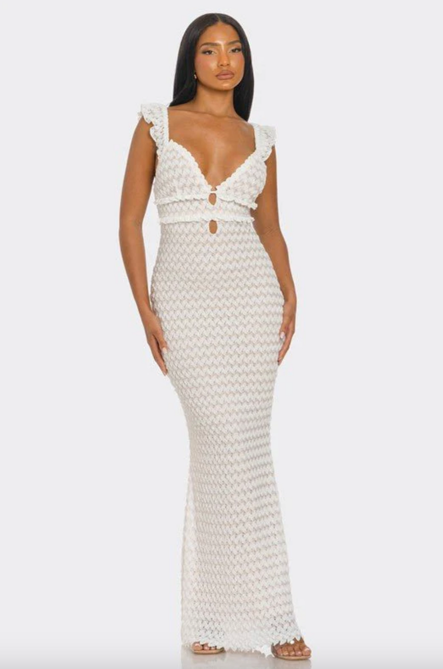Indulge in the chic allure of the EZRA Knit Maxi Dress, a captivating piece that effortlessly blends comfort and style. The V neckline and flutter sleeves add a touch of femininity,